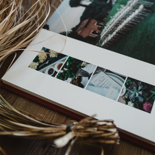 High-quality, handmade fine art wedding album on a table shot from above