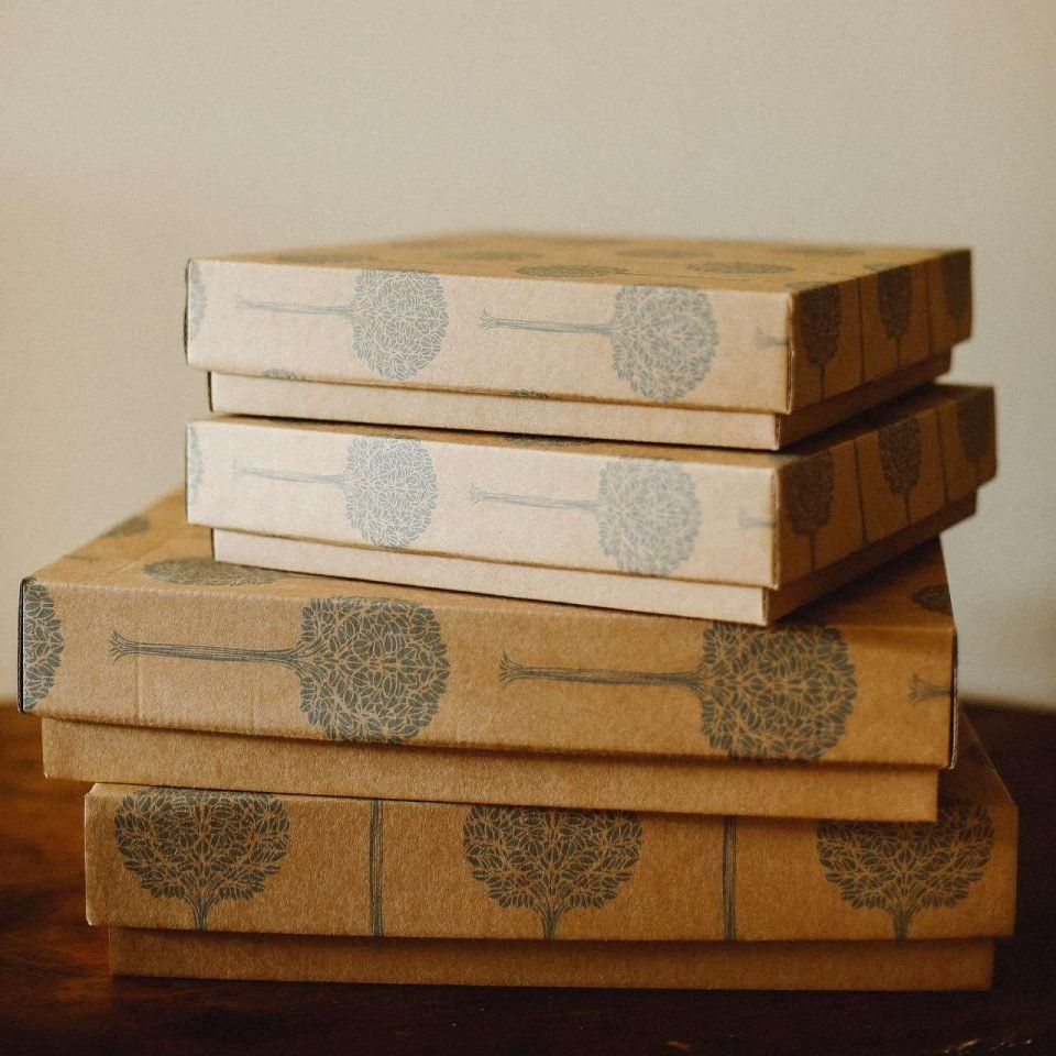 A stack of Folio kraft presentation boxes