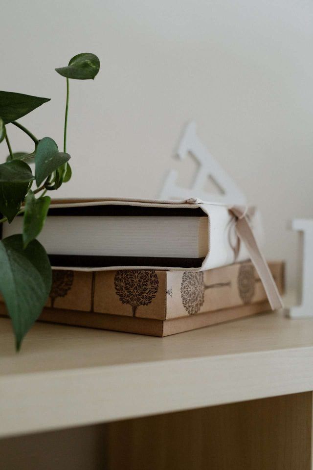 A Folio Matted Album in a natural cotton wrap on it's kraft presentation box