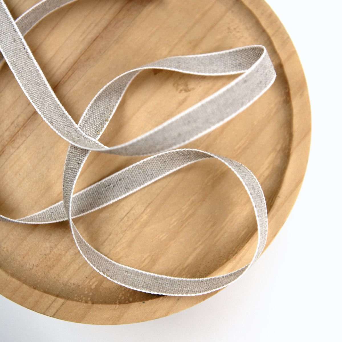 Example of Folio's natural linen ribbon used for box closures