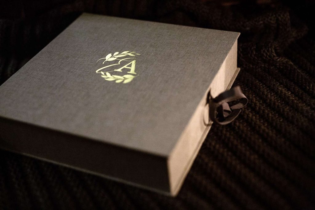 A bespoke made to order clamshell box with gold foiling on the lid