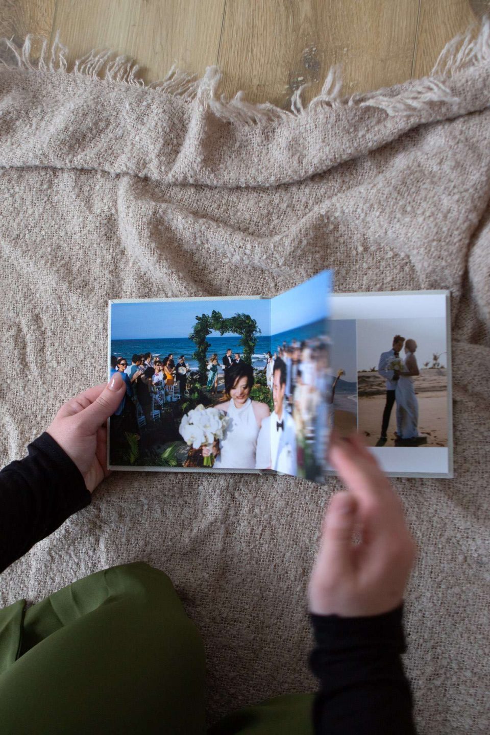 A woman holding an affordable quality small copy wedding album