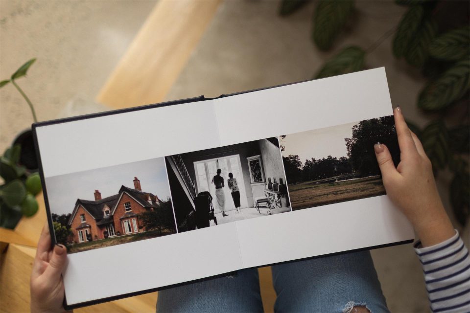 A woman with Folio wedding albums on her lap