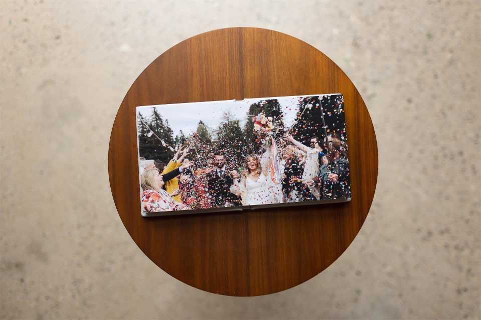 A shot from above showing the album pages printed on fine art paper in a mini copy album