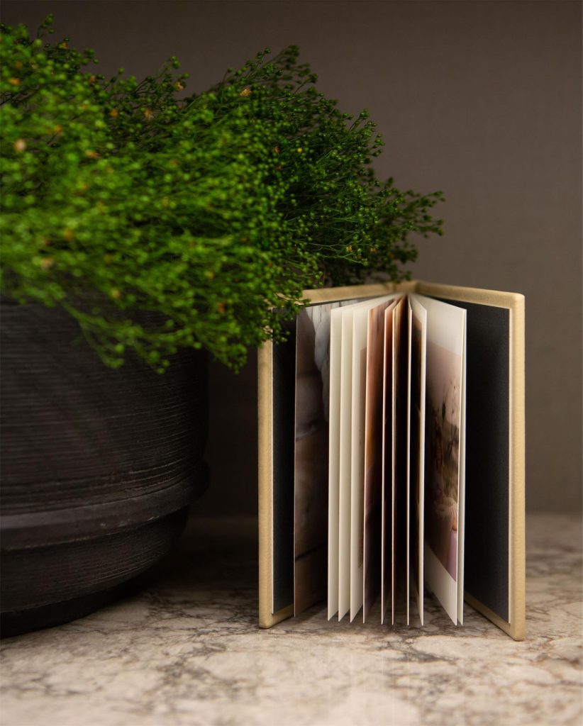 A mini copy album with it's pages fanned open