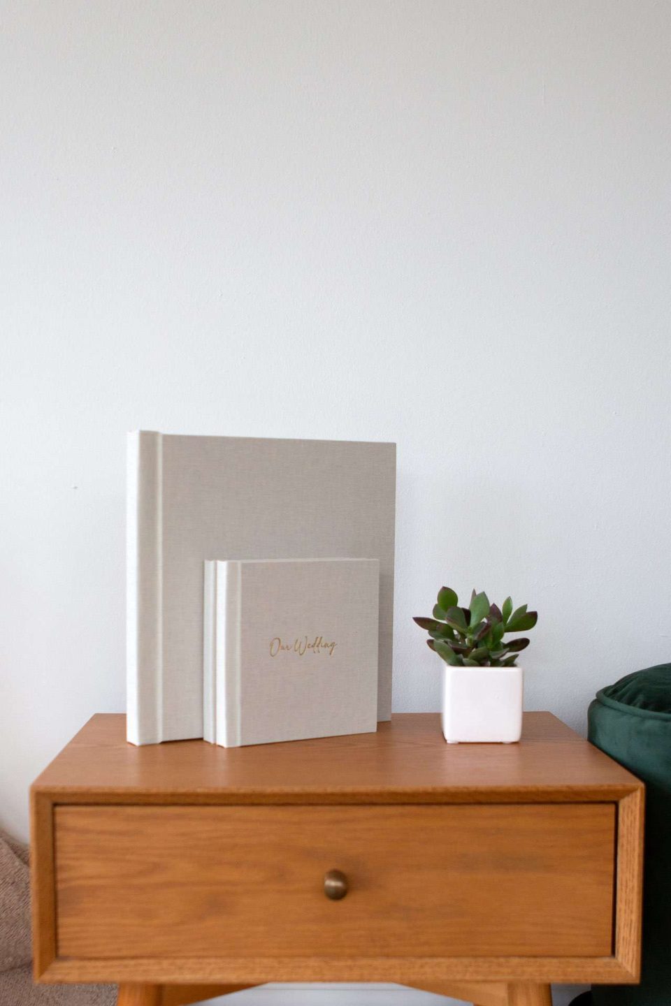 A large and smaller photo album next to each other on a table