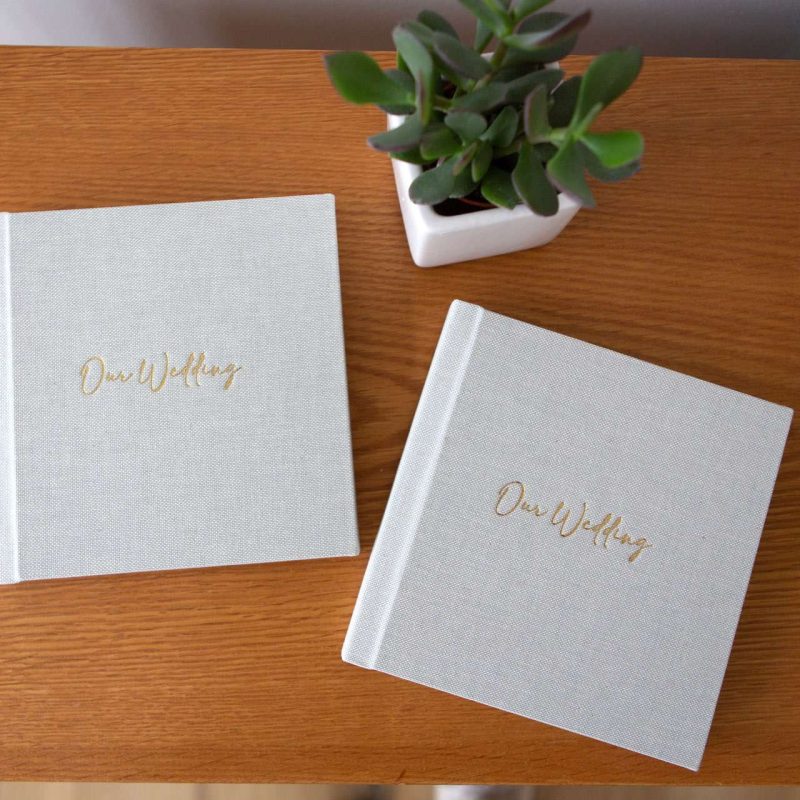 Two affordable fine art albums on a table both with personalisation