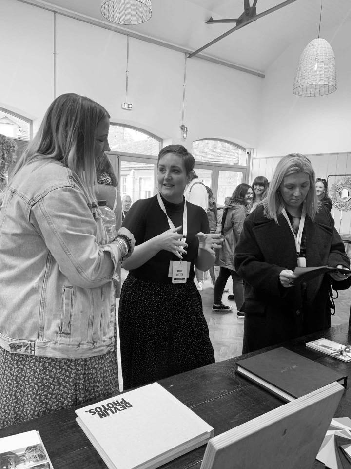 Folio team members helping photographers at a workshop
