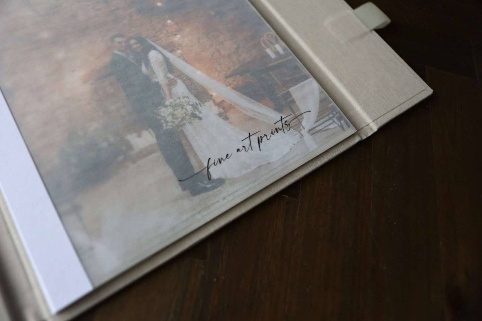 A detail shot showing the printed vellum cover in the Luxury Print Folder with the words Fine Art Prints