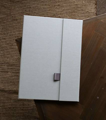 A grey fabric print folder made with attention to detail in the UK