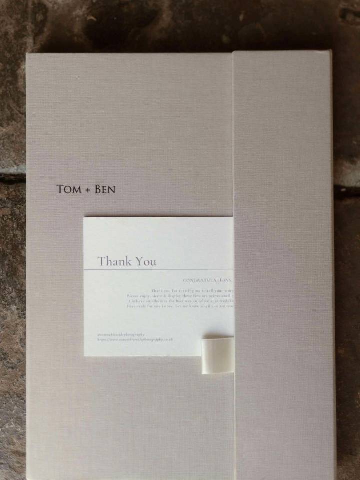 A thank you card included with the Luxury Print Folder slipped in the cover closure