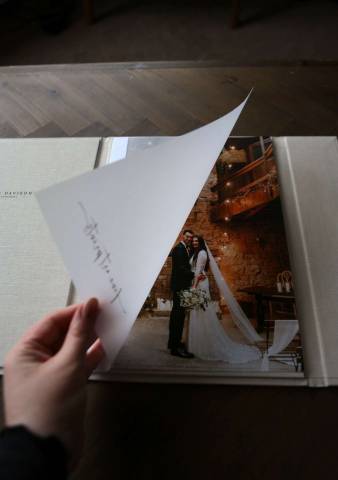 A luxury print folder with a velum page is opened to reveal A4 fine art prints