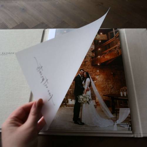 A luxury print folder with a velum page is opened to reveal A4 fine art prints