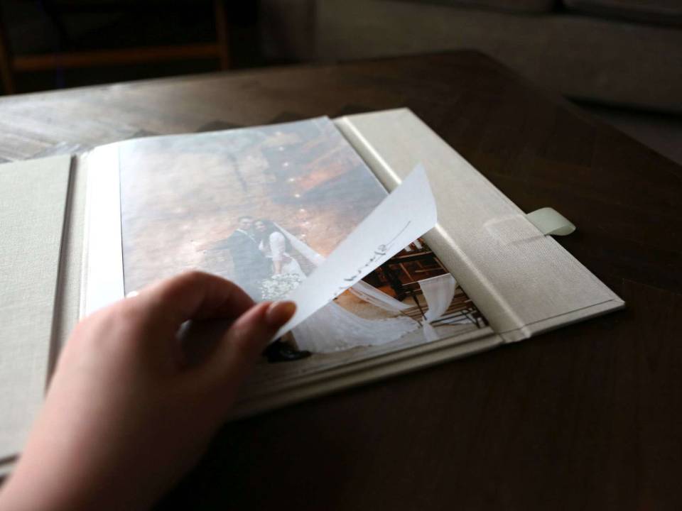 Opening the vellum page in the Luxury Print Folder that protects the high quality A4 fine art prints