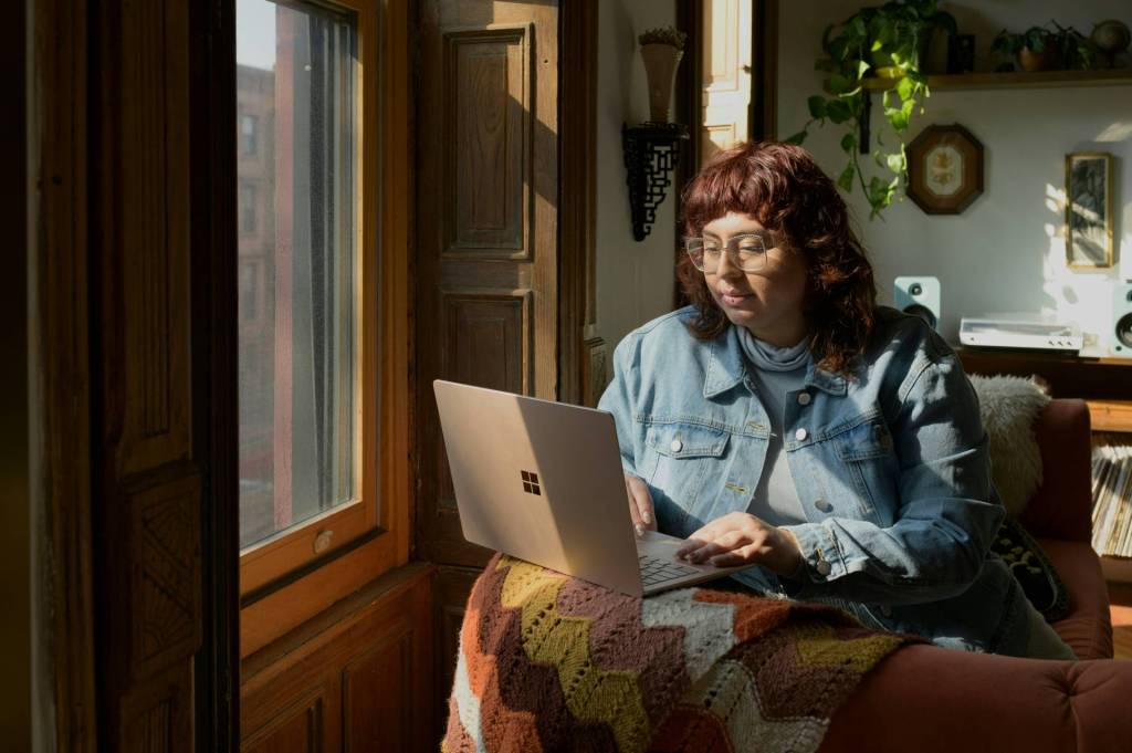 A person on a Zoom call with Folio albums getting help to grow their business