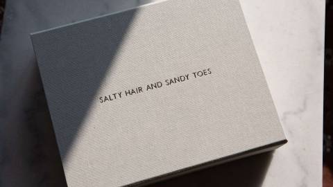 A handmade box to hold matted prints with gold foiling personalised text on the lid