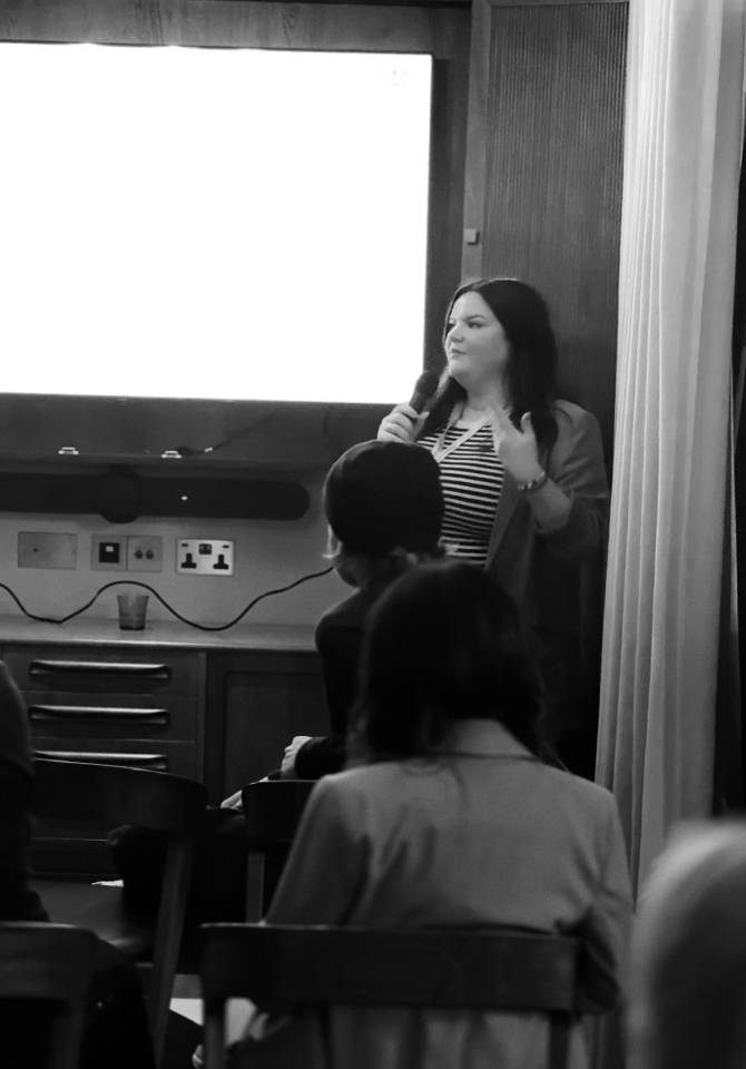 Folio presenting business marketing and sales strategies at a workshop for professional photographers