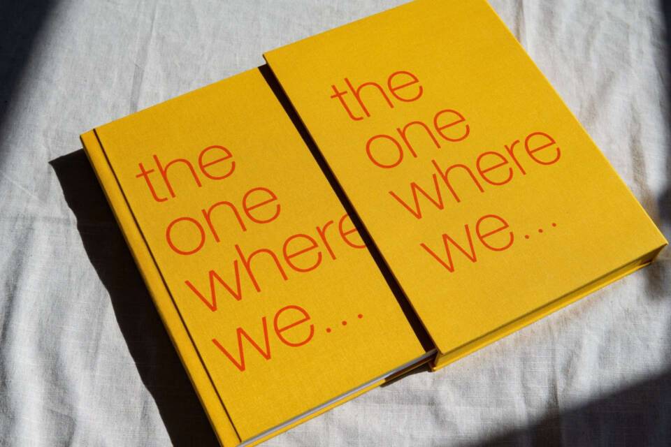 A desirable coffee table photo album and slipcase with an orange cover and red screen printed cover text