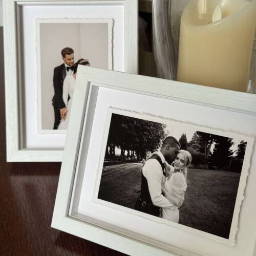 Two Folio Thank You Frames on a table one in front of the other both with deckle-edged prints